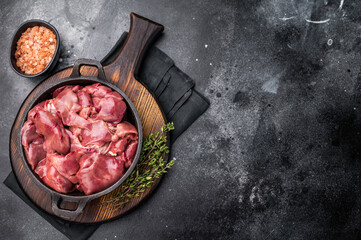 Vibrant raw chicken liver, perfect giblets  for those seeking a protein-rich addition to their meals.black background. top view