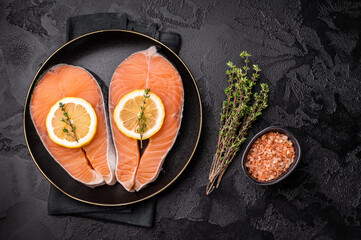 High-quality salmon portion, ready to be transformed into a gourmet dish. A versatile ingredient for both traditional and modern recipes. black background. top view