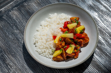 Chicken with pineapple in teriyaki sauce with fried rice. 