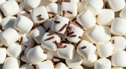 Close-up of mini marshmallows with chocolate sprinkles
