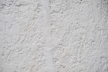 Obraz premium Textura de pared blanca rugosa con acabado irregular de yeso