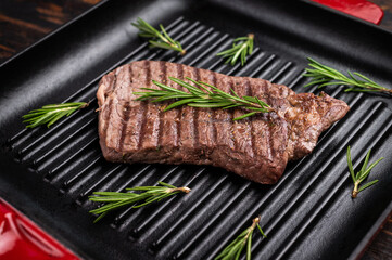Grilled beef Top sirloin steak or Rump steak in grill pan. wooden background. top view