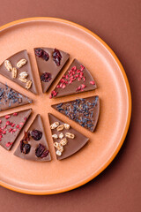 Craft home made chocolate with berries and fruits, delicious sweets. Craft chocolate