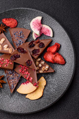 Craft home made chocolate with berries and fruits, delicious sweets. Craft chocolate