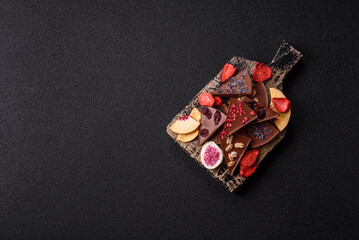 Craft home made chocolate with berries and fruits, delicious sweets. Craft chocolate