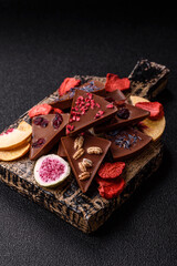 Craft home made chocolate with berries and fruits, delicious sweets. Craft chocolate