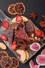 Craft home made chocolate with berries and fruits, delicious sweets. Craft chocolate
