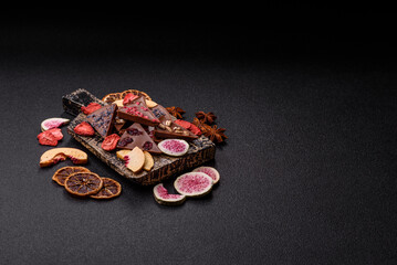 Craft home made chocolate with berries and fruits, delicious sweets. Craft chocolate