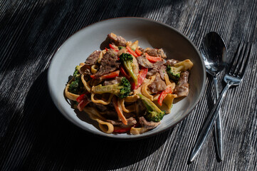 Pasta with beef, mushrooms and vegetables. 