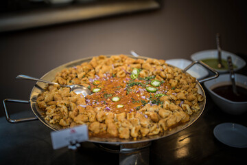 Cooking Chicken on big tava at Indian Wedding