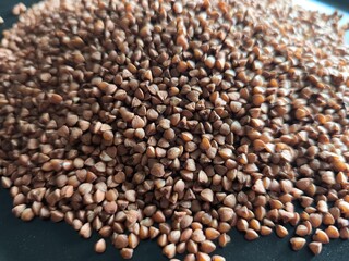 Buckwheat, superfood, healthy vegetarian food. Dry grits. Grains. Close-up