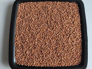 Buckwheat, superfood, healthy vegetarian food. Dry grits. Grains. Close-up
