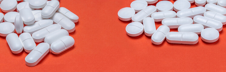Medical pills . On red background. Top view . Medicine concept