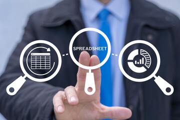 Business man using virtual touch screen clicks on the word SPREADSHEET. Spreadsheets Web Online Electronic Documents Information Financial Application Concept. Worksheet tables.
