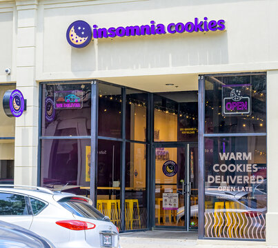 New Orleans, LA, USA - August 8, 2025: Front of Insomnia Cookies on Magazine Street in the Lower Garden District