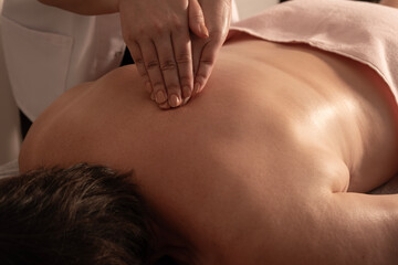 Fototapeta premium Relaxing massage therapy session. Therapeutic massage for relaxation. Professional spa body massage. Wellness and spa massage treatment.