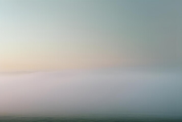 Fototapeta premium An abstract, minimalist background of a sea of fog with a pastel gradient sky