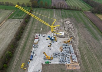 Large crane on the construction site of a wind turbine, wind turbine, tower construction, renewable...