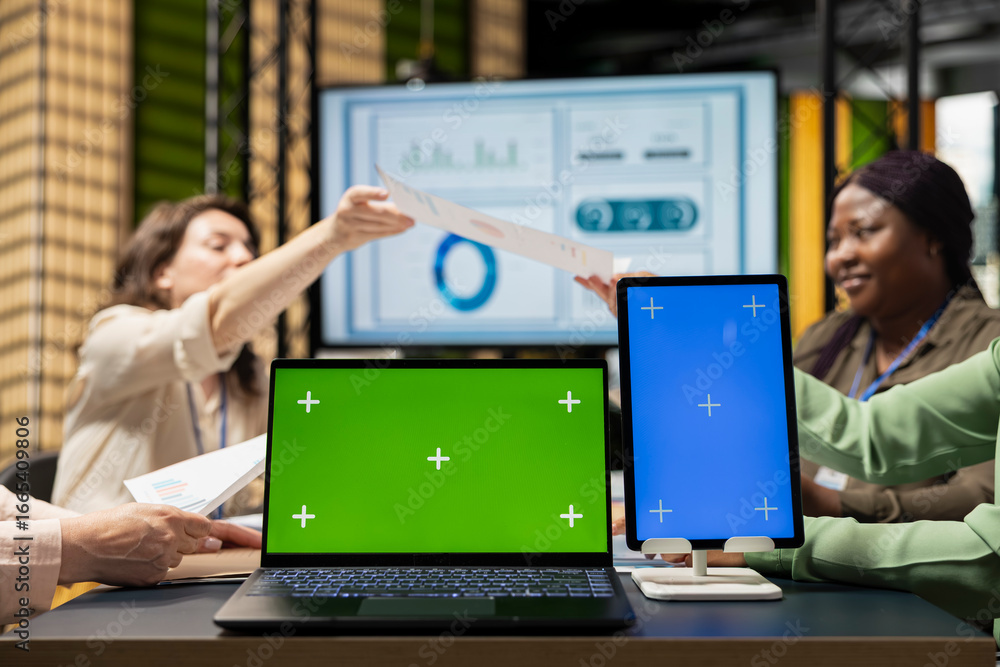 Poster diverse business associates using isolated display in modern office session, supporting digital plan