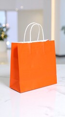 Orange shopping bag on white surface