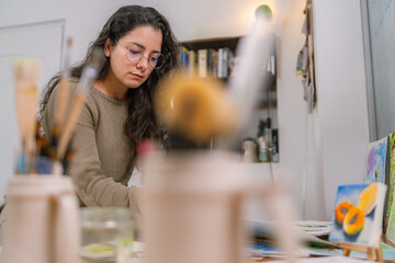 Graphic designer working from home in creative workspace