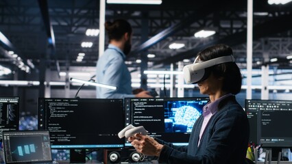 Data center engineer using virtual reality, managing AI systems for uptime and efficiency. IT employee using VR headset and artificial intelligence technology in server hub, camera A