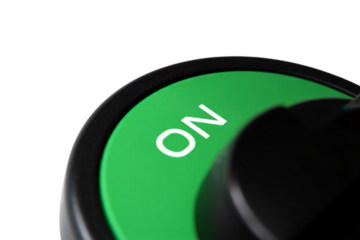 Close up of a green on switch with white lettering isolated on transparent background