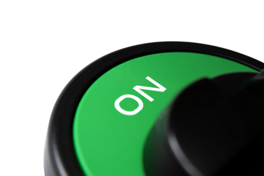 Close up of a green on switch with white lettering isolated on transparent background