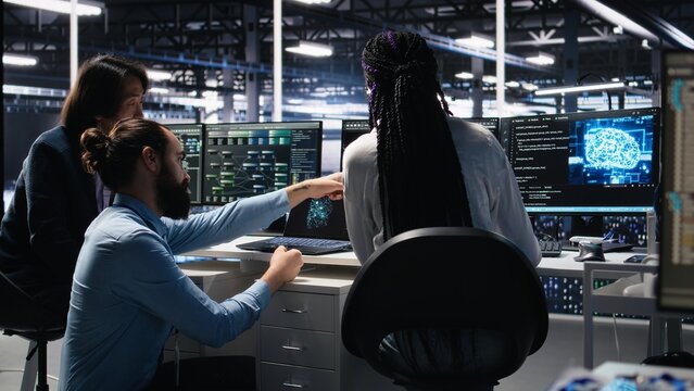 Data center software developers using machine learning algorithms to analyze large datasets. Server hub IT experts cooperating, using AI neural networks to recognize data patterns, camera A - Powered by Adobe
