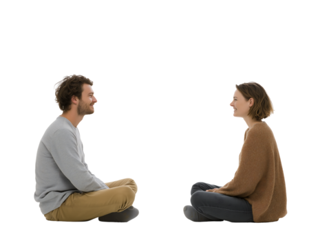 Happy Young Couple Sitting on Floor, Casual Clothing, Profile View, Conversation, Studio Shot