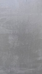 Surface texture displays subtle patterns in a muted gray tone with intricate brush marks and depth