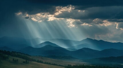 Obraz premium Majestic Mountain Landscape With Rays of Sunlight Breaking Through Clouds at Dawn