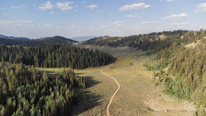 Aerial Scenic Mountain Landscape in Peter Sinks, Utah – Alpine Meadows, Rocky Hills, and Pine...