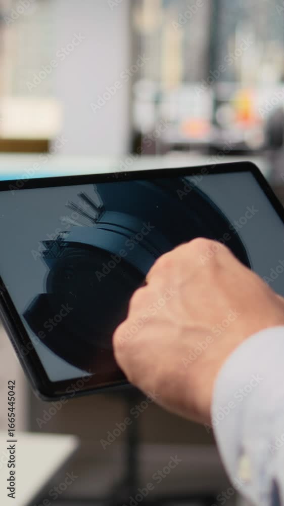 Poster close up of researcher analyzing turbine component on tablet to maximize sustainability. cad designe