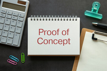 There is notebook with the word Proof of Concept. It is as an eye-catching image.