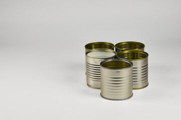 Metal and glass containers stacked for recycling because they are no longer used on a daily basis,...