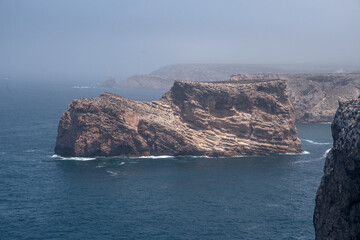 San Vicente Cape cliffs in the Algarve region of Portugal in a sunny day.