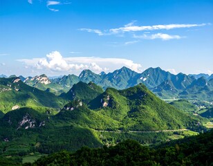 Obraz premium Lush mountain range under a vast blue sky