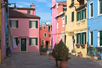 Colorful residential street with facades in Burano Italy