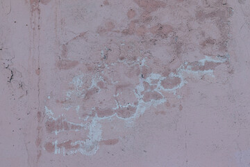 Cement wall covered in black mold spots