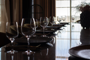 Detailed view of empty glasses placed in a hotel bar in backlighting