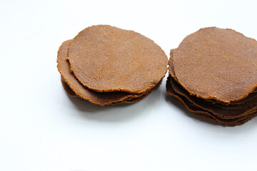 Fermented soybean discs, known as “Thua Nao,” a traditional Thai seasoning used to enhance flavor in Northern cuisine.