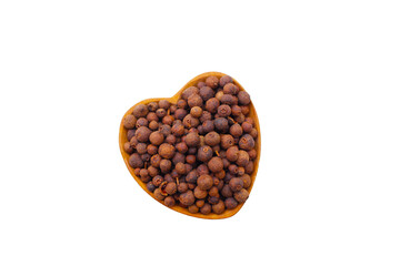 Brown dried allspice spice seeds.