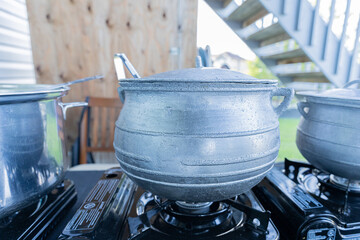 Nigerian cooking pots at a party buffet