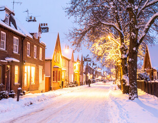 Enchanted Winter Street Scene Snow Covered Houses and Glowing Lights