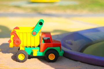 Colorful toy dump truck on playground