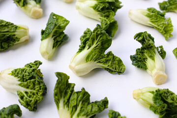 Fresh baby bok choy with crisp white green leaves.
