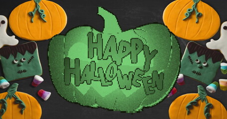 Pixelated green pumpkin image with Halloween candies and decorations