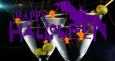 Image of happy halloween text over drinks