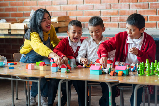 Teacher playing with students at school